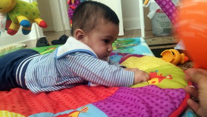 cute Baby is playing with balloon in Britian