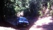 Creek Road, Watagans. Hilux 4wd up a muddy hill