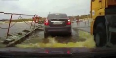 Truck turn cars in submarines on pontoon bridge in Russia