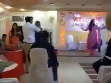 Female teacher dancing between students in Private college in Lahore