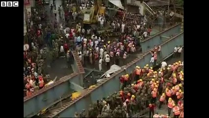 The BBC's Rahul Tandon says the situation is chaotic, with police beating people back from the scene