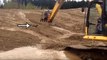 Badass Excavator Operator Rescues Baby Deer Hopelessly Stuck In Mud