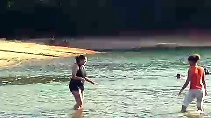 cristina and some girl wrestling in the lake