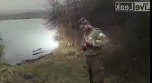 A member of the glorious Armed Forces of Ukraine goes fishing using hand-grenades