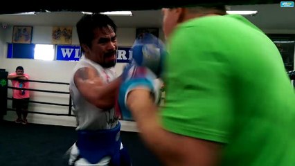 Pacquiao pummels the mits with Freddie Roach