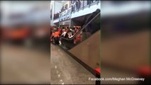 Moment escalator speeds up throwing hockey fans into a panic