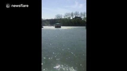 Wind vortex flips tourist boat in Chinese lake