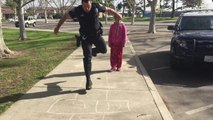 Police officer playing intense game of hopscotch with homeless girl goes viral