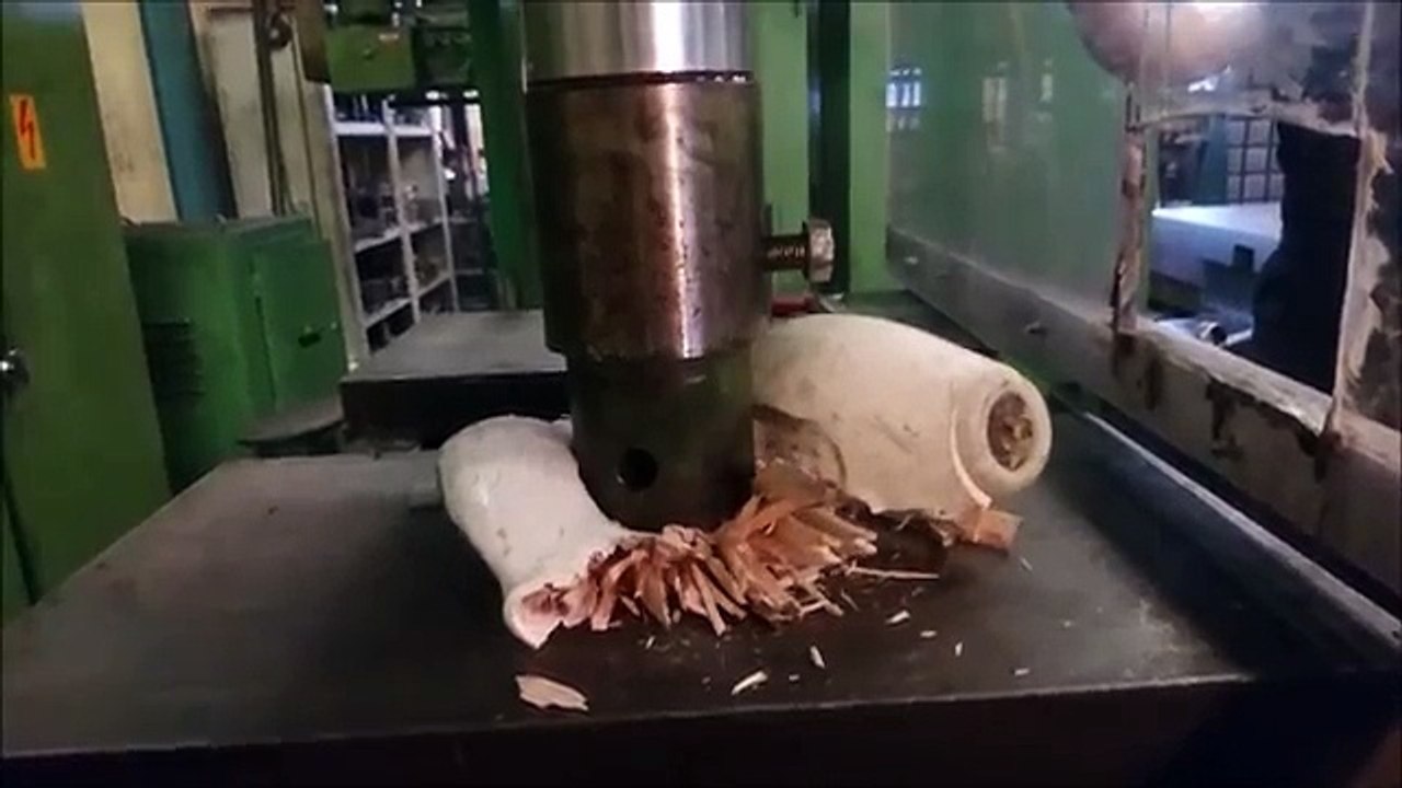 Crushing bowling ball and pin with hydraulic press