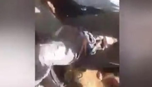 Düşürülen Suriye uçağının pilotunu yerlerde sürüklediler