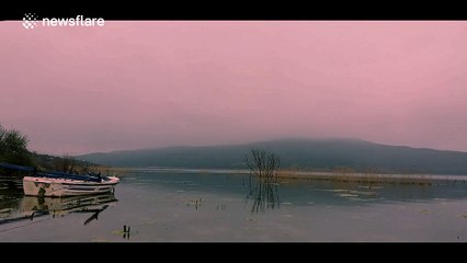 Boat rocks from side-to-side in beautiful lake time-lapse