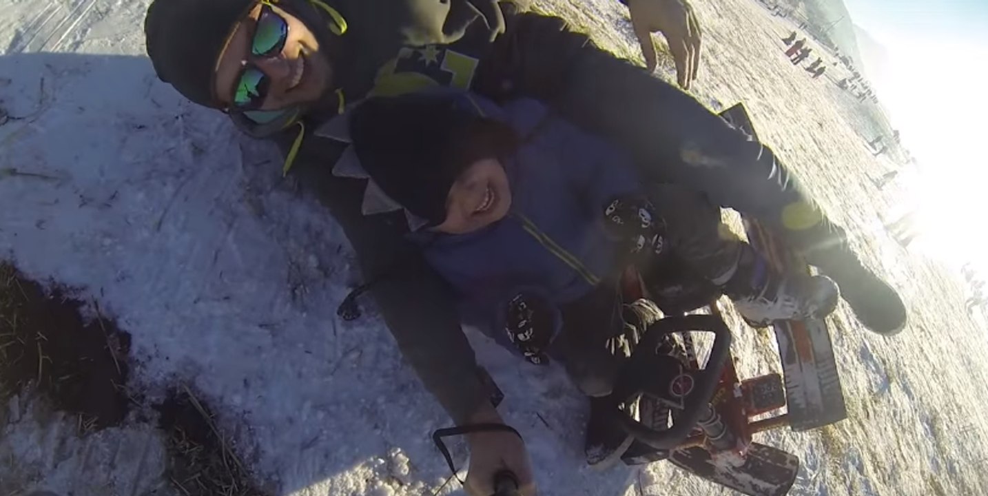 Dad and Son Enjoy Some High-Octane Sledding Fun