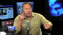 Alex Jones Shows Off His Gun on Live Radio Show: Don't Mess With Him