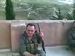 Syria - an army sniper on the roof of a buildings.mp4