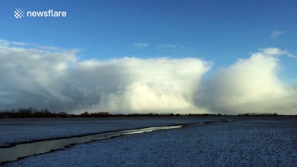 Beautiful, time-lapse of snow storm moving away
