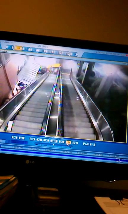 Drunk girl falls down escalator