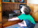 Jake as a toddler watching Peppa Pig and giggling, very cute