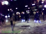 Pedestrians run accross road in piccadilly circus.