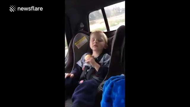 Toddler falls asleep while eating ice cream