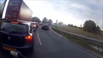 Driver tries to show up biker and instantly regrets it...