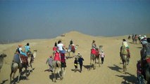 Camel ride to the Sphinx with the Great Pyramids in the background