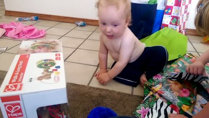 Rex opening birthday gifts...with help