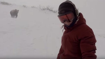 Oblivious Snowboarder Doesn&#39;t Realize She&#39;s Being Chased By A Ferocious Bear