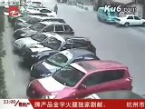 Chinese man throws bicycle at thieves as they ride past him on their motor-scooter.flv