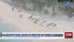 Sauvé grâce à leur message HELP sur le sable