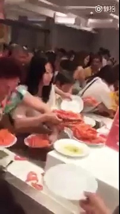 Chaos reigns as hungry Chinese tourists fight over jumbo shrimp in buffet restaurant in Thailand