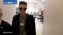 Ruby Rose prepares for takeoff in black jacket and ripped jeans