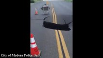 Huge SINKHOLE swallows up a large portion of road in Madera, California
