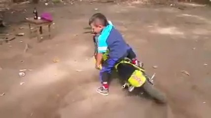 funny videos small kid showing stunts on his mini bike