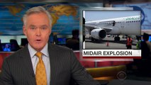 Midair explosion leaves hole in passenger plane