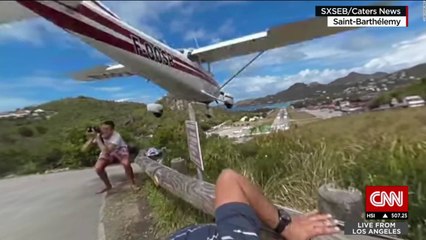 Tourist almost gets hit by a plane