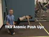 TRX Atomic Push Ups are shown by St. Augustine Fitness Boot Camp Trainer