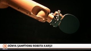Masa tenisi oynayan robot