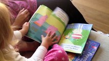 2 year old girl reads whole peppa pig book