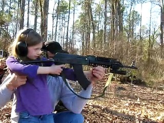 GIRL SHOOTS AK-47