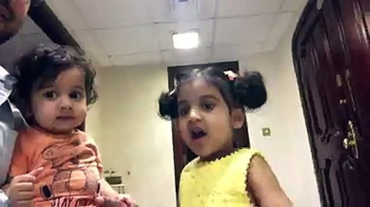 a cute baby is teeling the rhyme