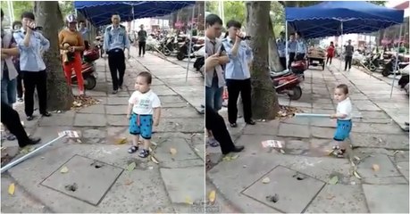 Criança destemida usa tubo de aço para defender a avó da polícia