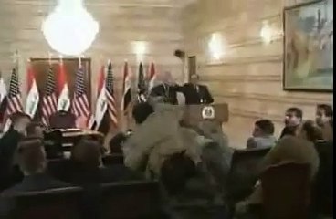 Iraqi journalist throws shoes at evil terrorist Bush