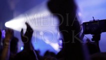 Making party at a rock concert. Hands hold cameras with digital displays