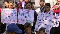 Refugees on the Greek island of Lesbos welcome Pope Francis