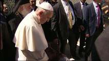 Woman cries in front of Pope on Greek island of Lesbos