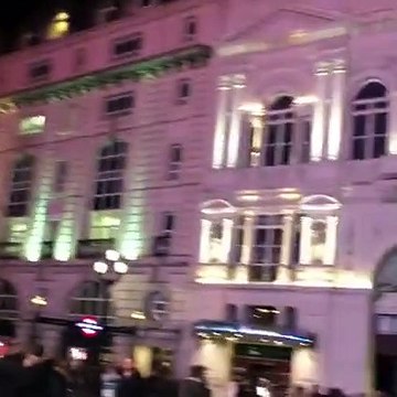 Nawaz zardari Eye to Eye in London. A Pakistani guy standing in front of hotels bashing them