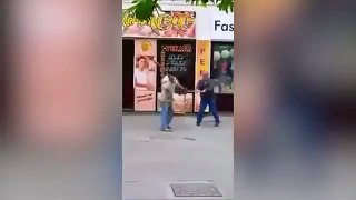 Street fighters  Two men attack each other with straw brooms   Daily Mail Online