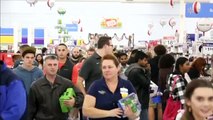 Shoppers crowd retail stores for early Black Friday discounts.