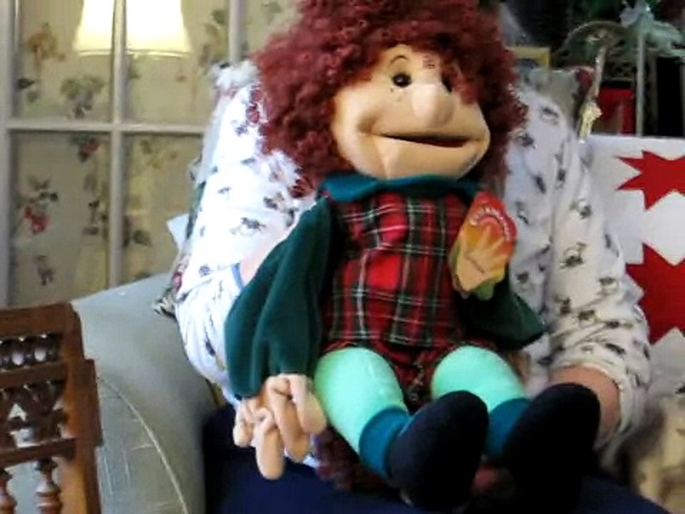 Sheila's puppet sings "The Sun'll Come Out"