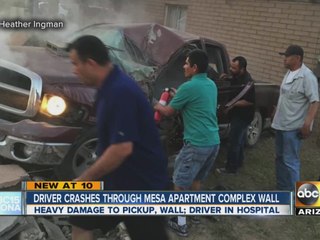 Driver hospitalized after truck plows through two walls